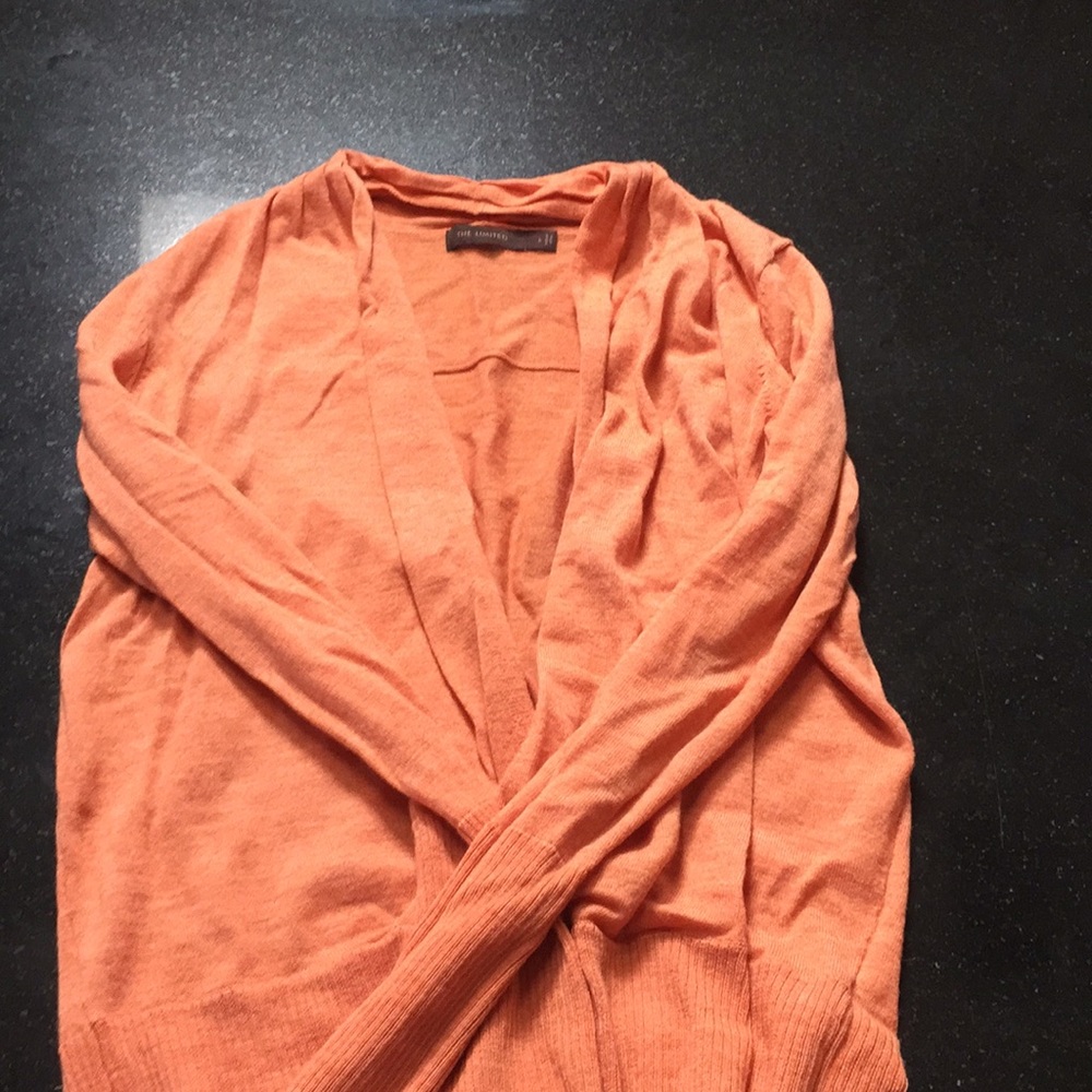 Waisted cross sweater